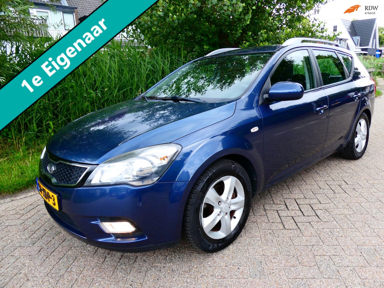 Kia Cee'd Sporty Wagon - 1.4 CVVT Plus Pack Clima Cruise Navi Trekhaak 1200kg. - AutoWereld.nl