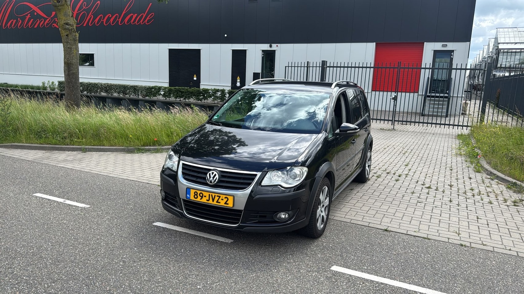 Volkswagen Touran Cross - 2.0 TDI Highline 7 PERSOONS AUTOMAAT CLIMA ZWART 2009 - AutoWereld.nl