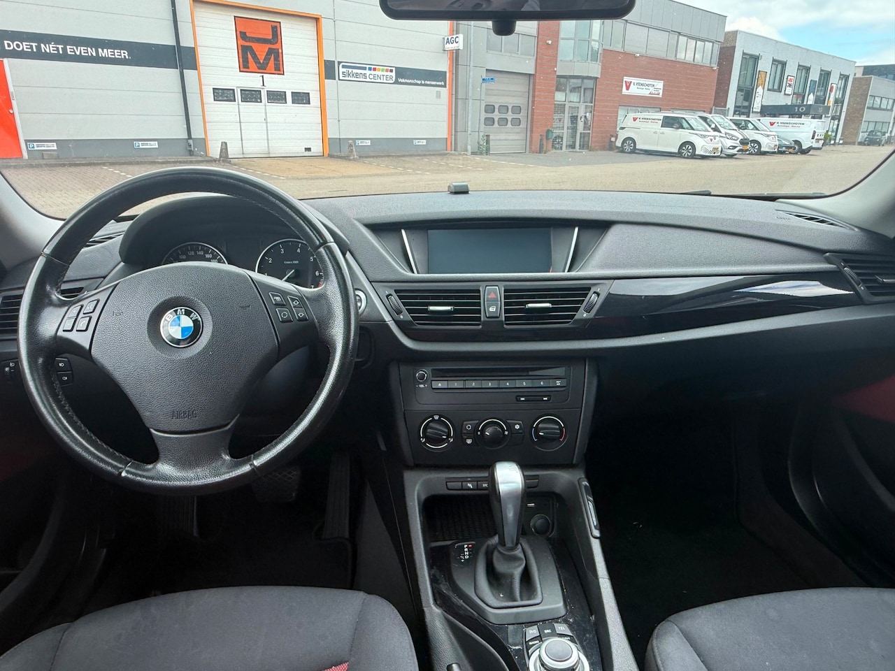 BMW X1 - SDrive18i 230.000 KM AUTOMAAT PANORAMA DAK AIRCO ZWART 2010 - AutoWereld.nl