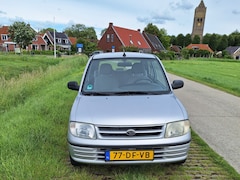 Daihatsu Cuore - 1.0-12V XTi