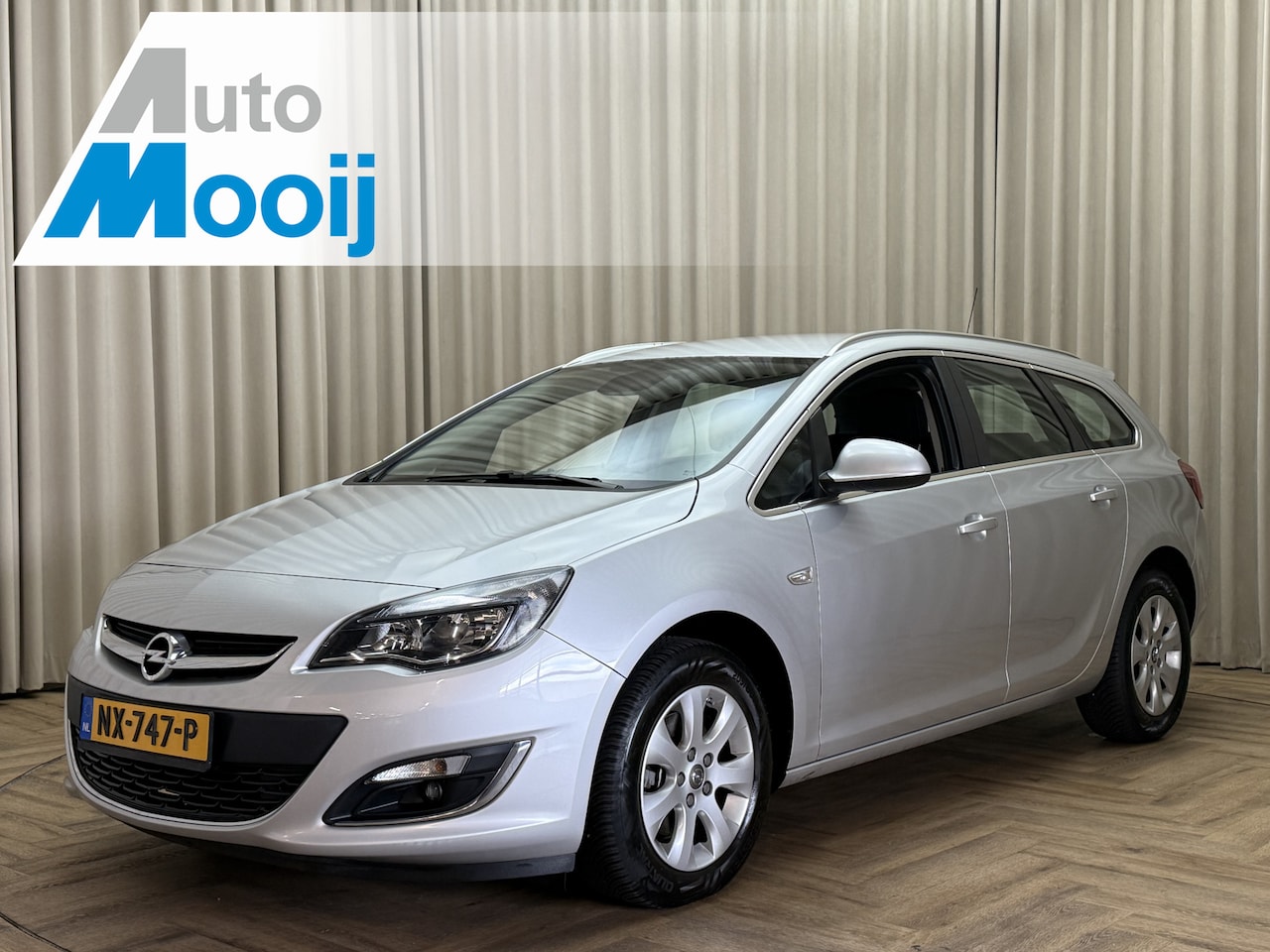 Opel Astra Sports Tourer - 1.6 CDTi Edition Navigatie / 1/2 Leder / Cruise / ECC Clima / PDC / 16'' LMV - AutoWereld.nl