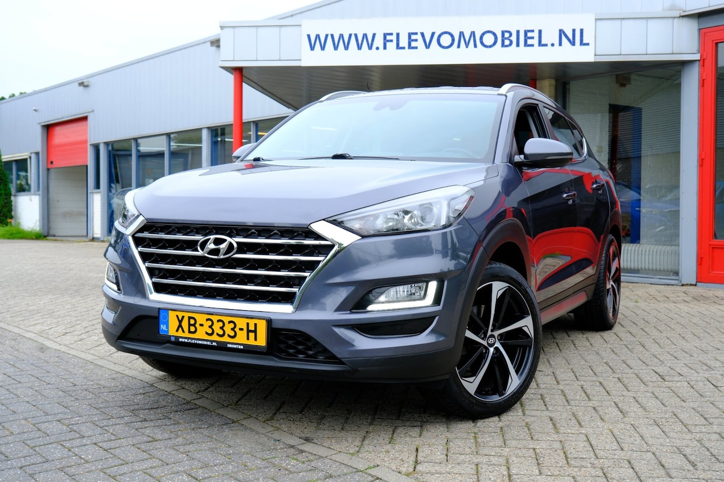 Hyundai Tucson - 1.6 GDI Comfort Navi|Cam|Clima|LMV|CarPlay - AutoWereld.nl