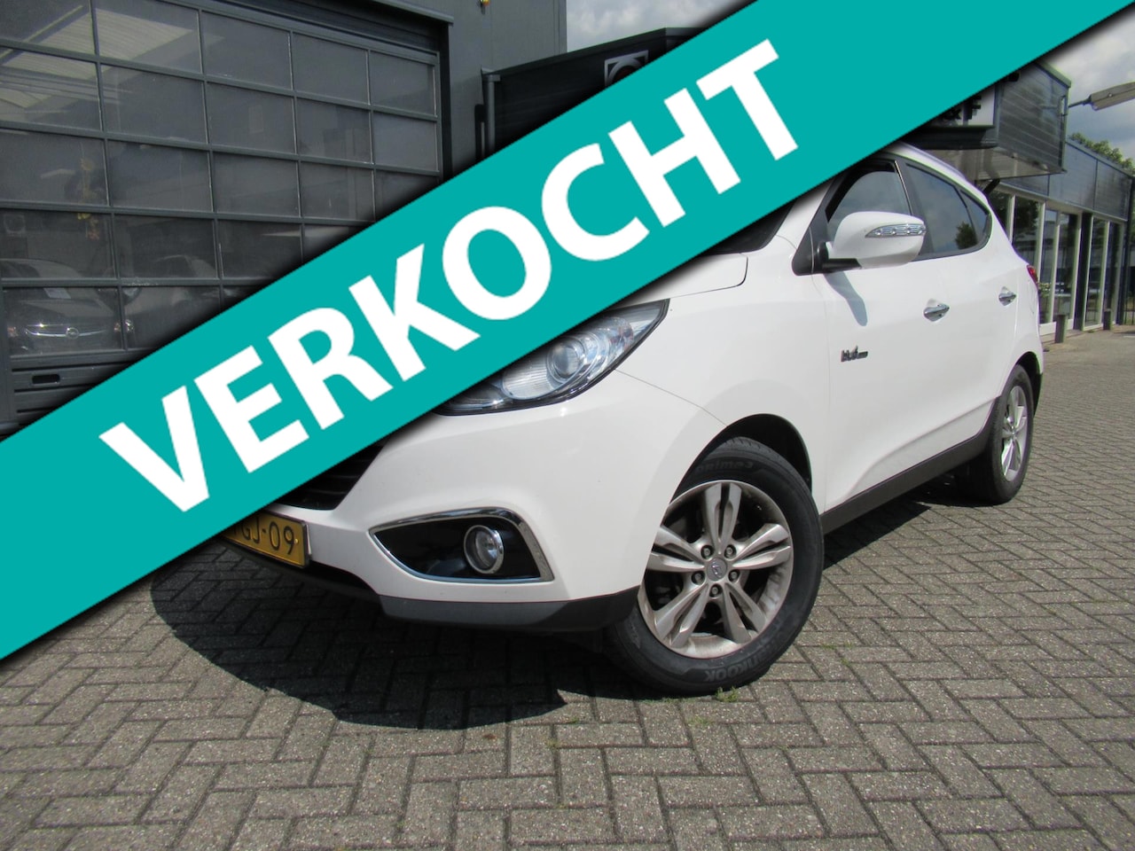 Hyundai ix35 - 1.6i GDI i-Catcher / NAV / ECC / Stoelverwarming / Half Leder - AutoWereld.nl
