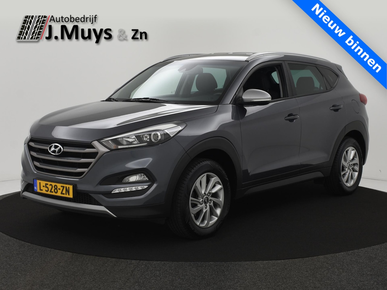 Hyundai Tucson - 1.6 GDi Comfort TREKH|NAVI|CAMERA|BLIS|WINTERPACK|CLIMA|CARPLAY - AutoWereld.nl