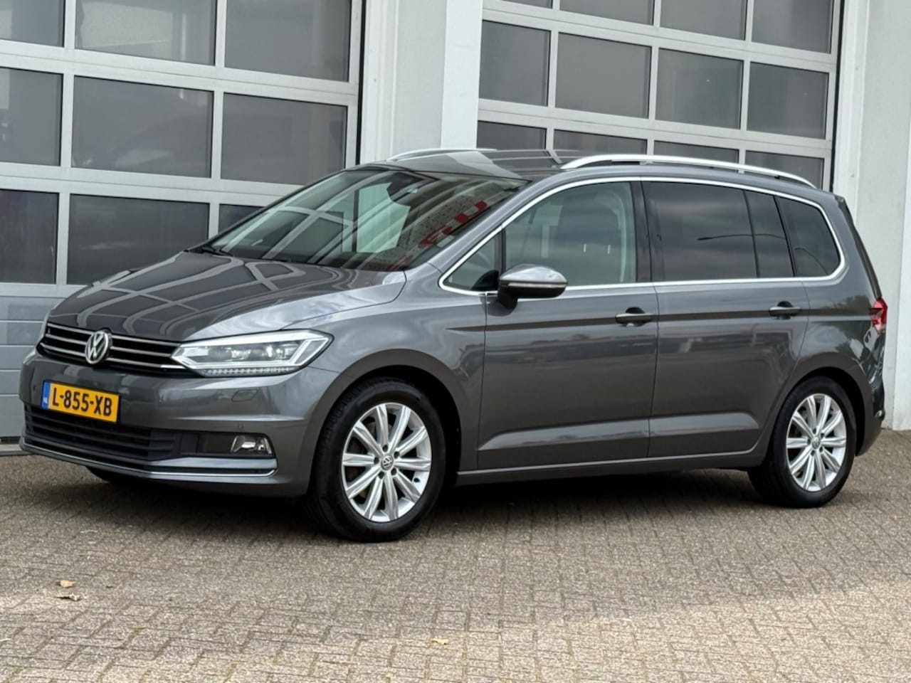 Volkswagen Touran - 1.8 TSI 180PK Highline 7-Pers Aut. Navi Camera Pano Trekhaak - AutoWereld.nl