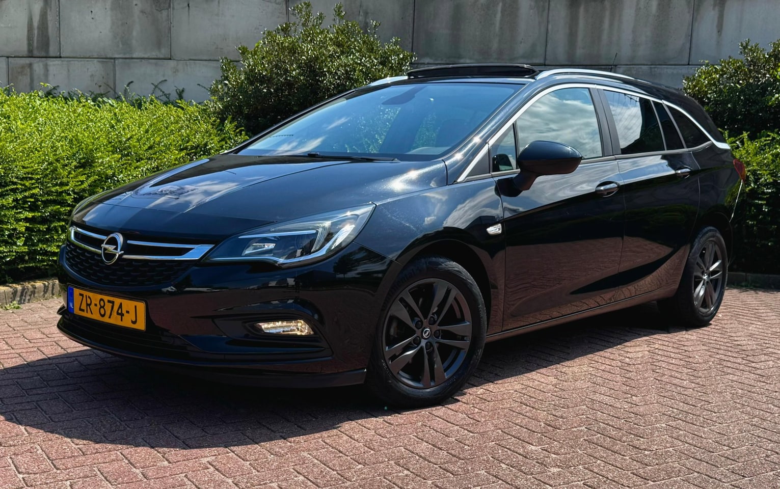 Opel Astra Sports Tourer - 1.0 Turbo 120 Jaar Edition/2DE EIG/RIJKLAAR/ - AutoWereld.nl