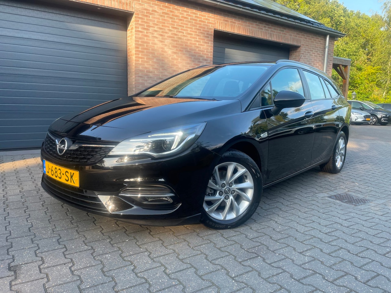 Opel Astra Sports Tourer - 1.2 Business Edition AIRCO NAVI PDC 2020 - AutoWereld.nl