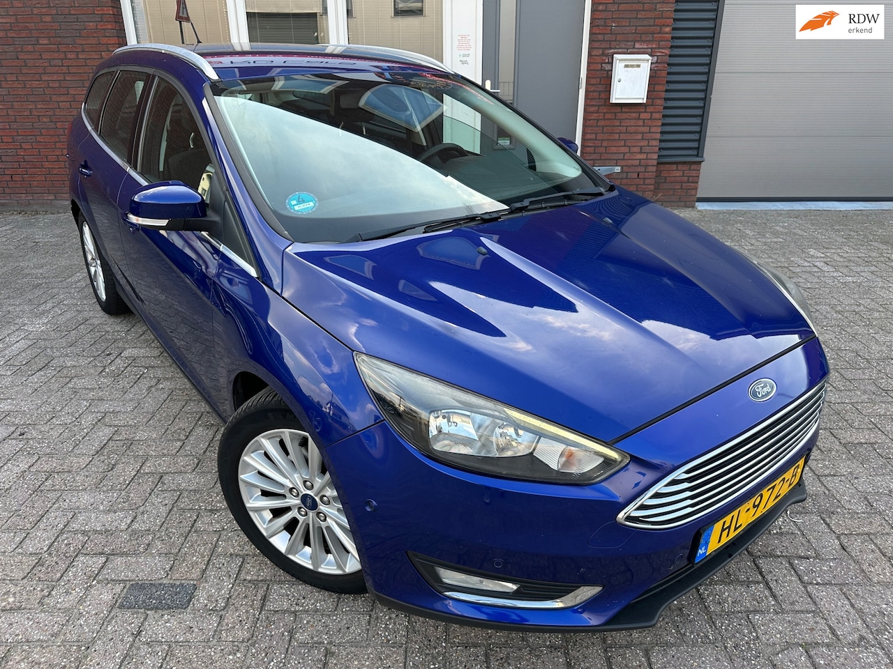 Ford Focus Wagon - 1.0 Titanium Edition / Navi / PDC / Clima / Cruise / NAP / LM - AutoWereld.nl