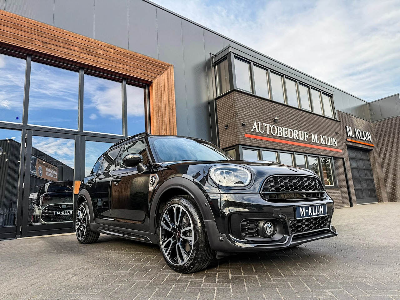 MINI Countryman - Cooper S E ALL4 John Cooper Works 220pk/Navi/Camera/Head up/19"Jcw/14.000km - AutoWereld.nl