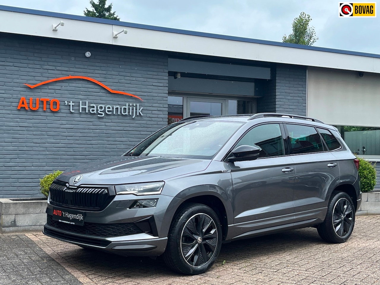Skoda Karoq - 1.5 TSI 150PK Sportline pano trekh 1EIG - AutoWereld.nl