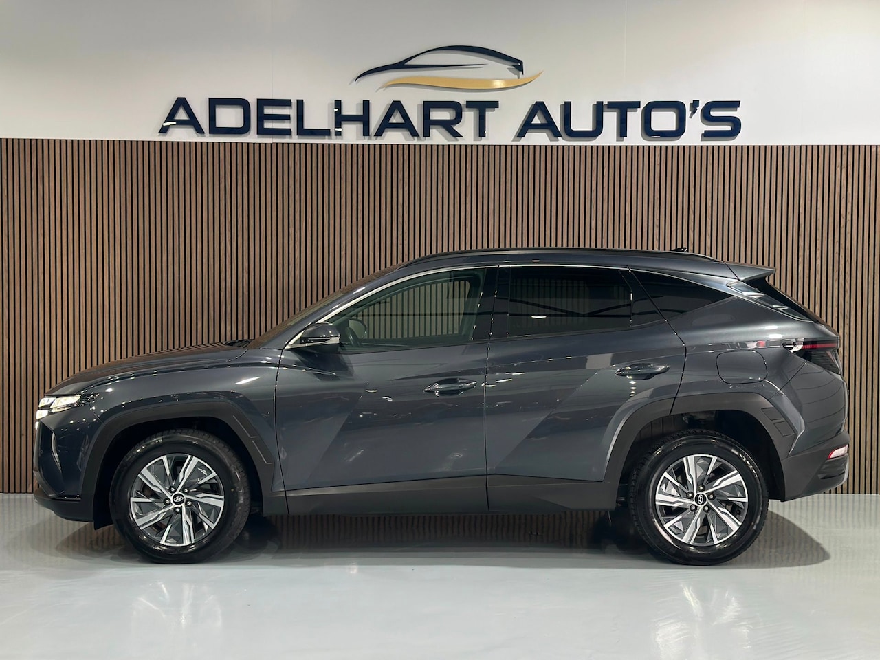 Hyundai Tucson - 1.6 T-GDI HEV Comfort 230 PK Automaat / Navigatie full map / Camera / Cruise control / Cli - AutoWereld.nl