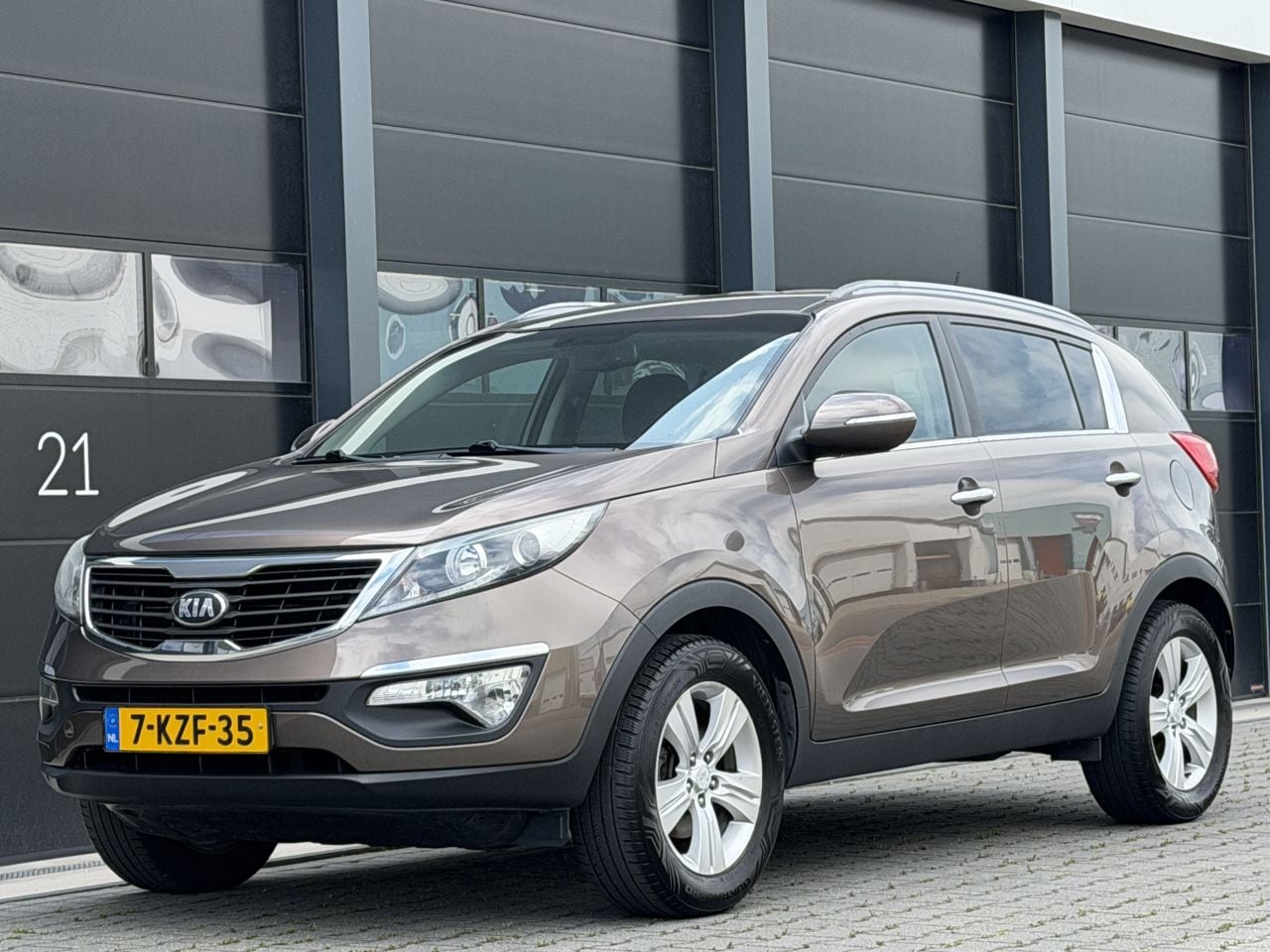 Kia Sportage - 1.6 GDI Navi Leer Clima PDC - AutoWereld.nl