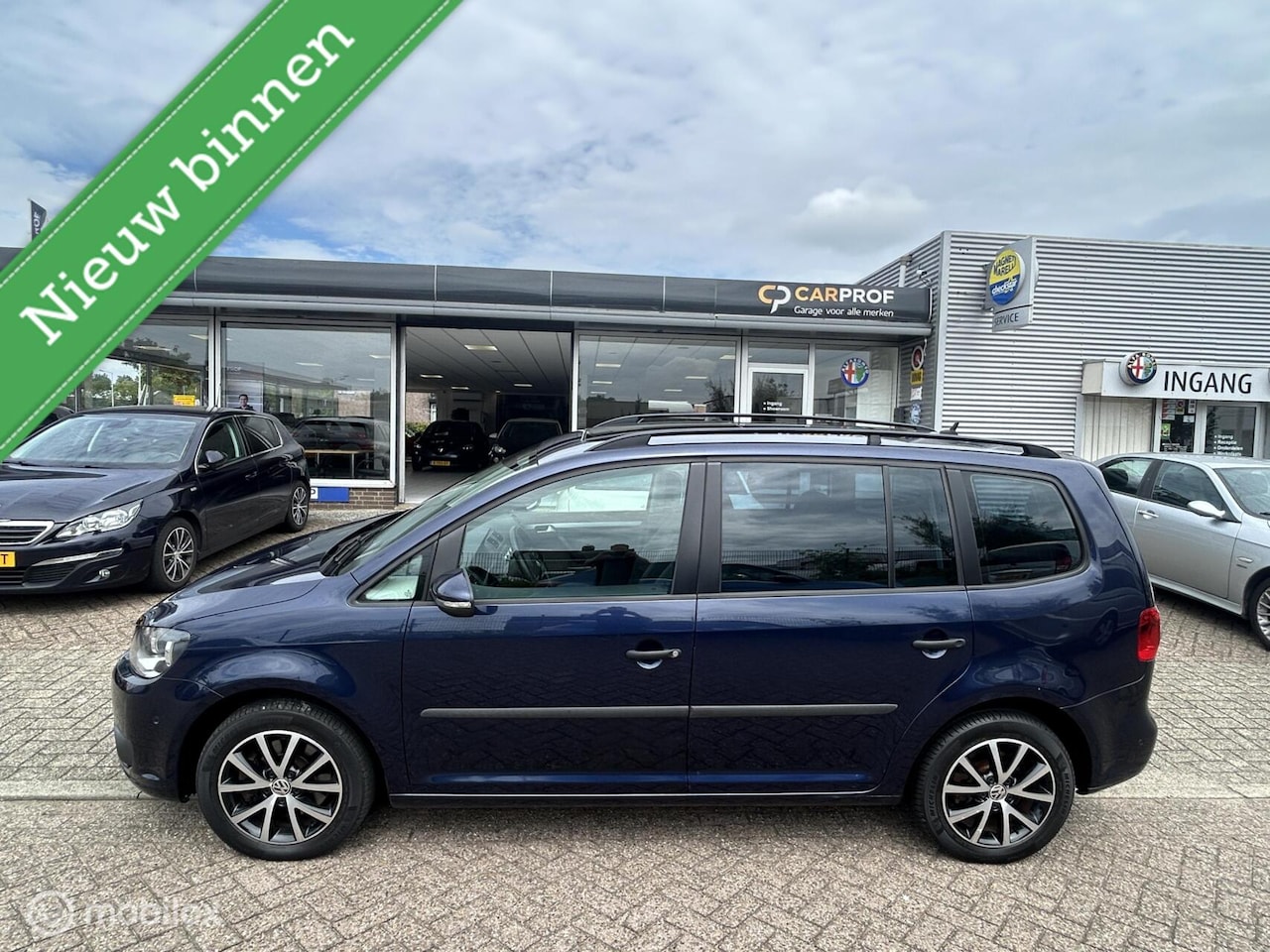 Volkswagen Touran - 1.4 TSI Highl. 7p. Automaat Pano - AutoWereld.nl