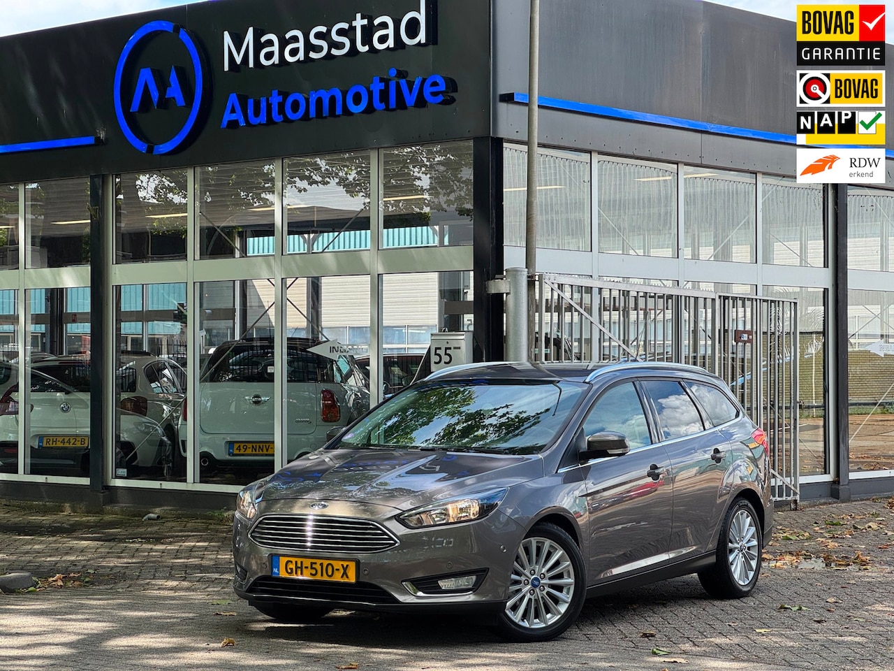 Ford Focus Wagon - 1.0 Titanium Edition Dealer onderhouden Facelift Navi Airco LM velgen - AutoWereld.nl