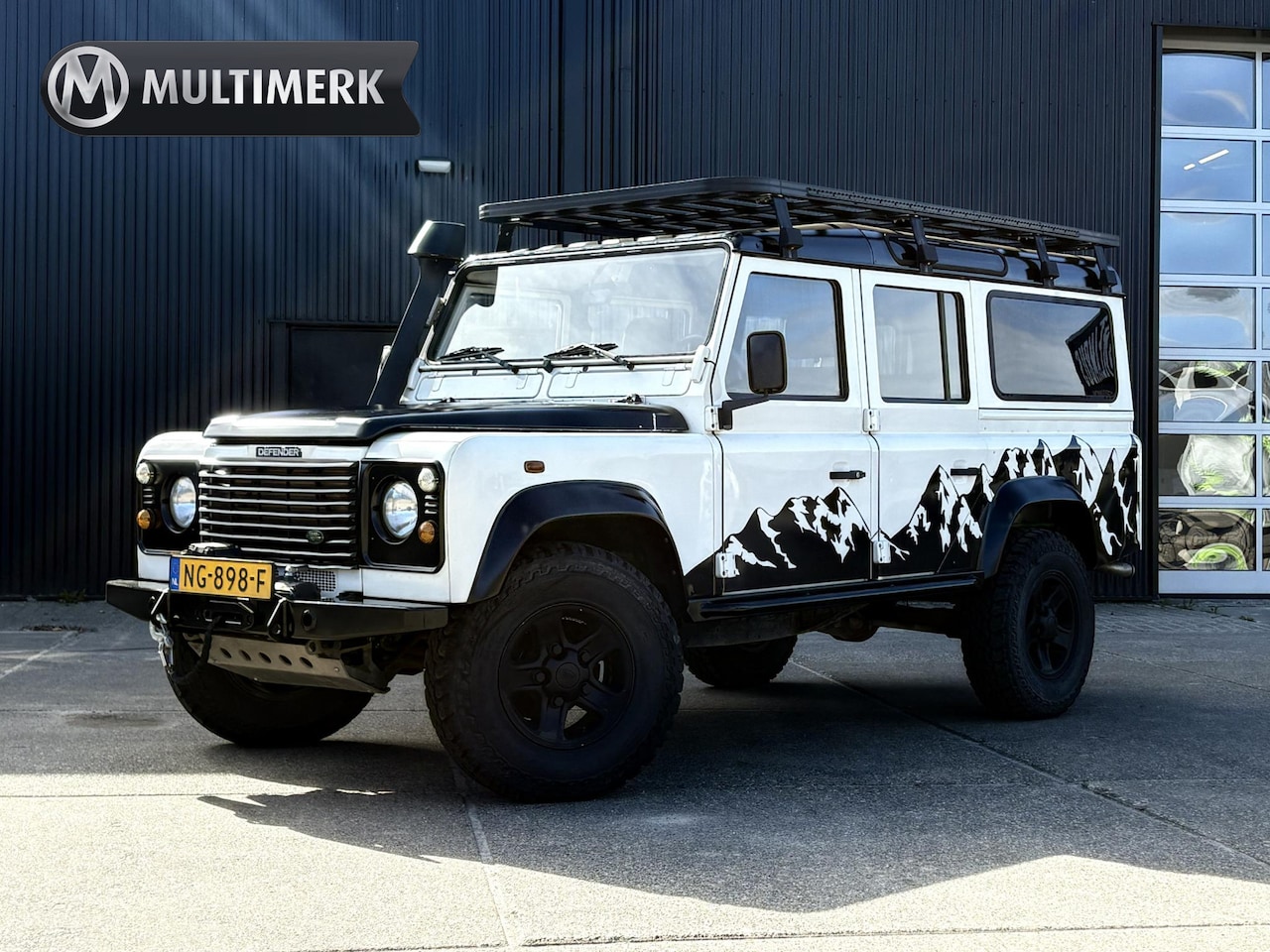 Land Rover Defender 110 - 2.5 TD5 SAFARI | GRIJS KENTEKEN 2P | LIER | LUXE STOEL | SNORKEL | DAKTENT FEMKES | RVS UI - AutoWereld.nl
