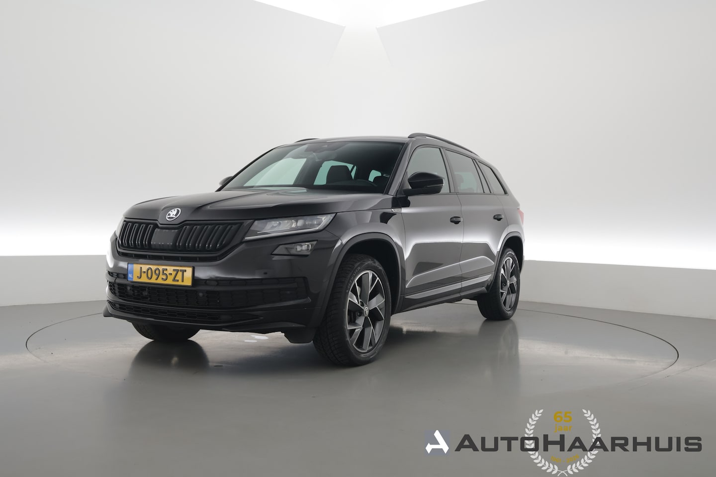 Skoda Kodiaq - 1.5 TSI Sportline Business 7p. DSG | Navi | Elek. Trekhaak | Stoel- Stuurverw. | Apple Car - AutoWereld.nl