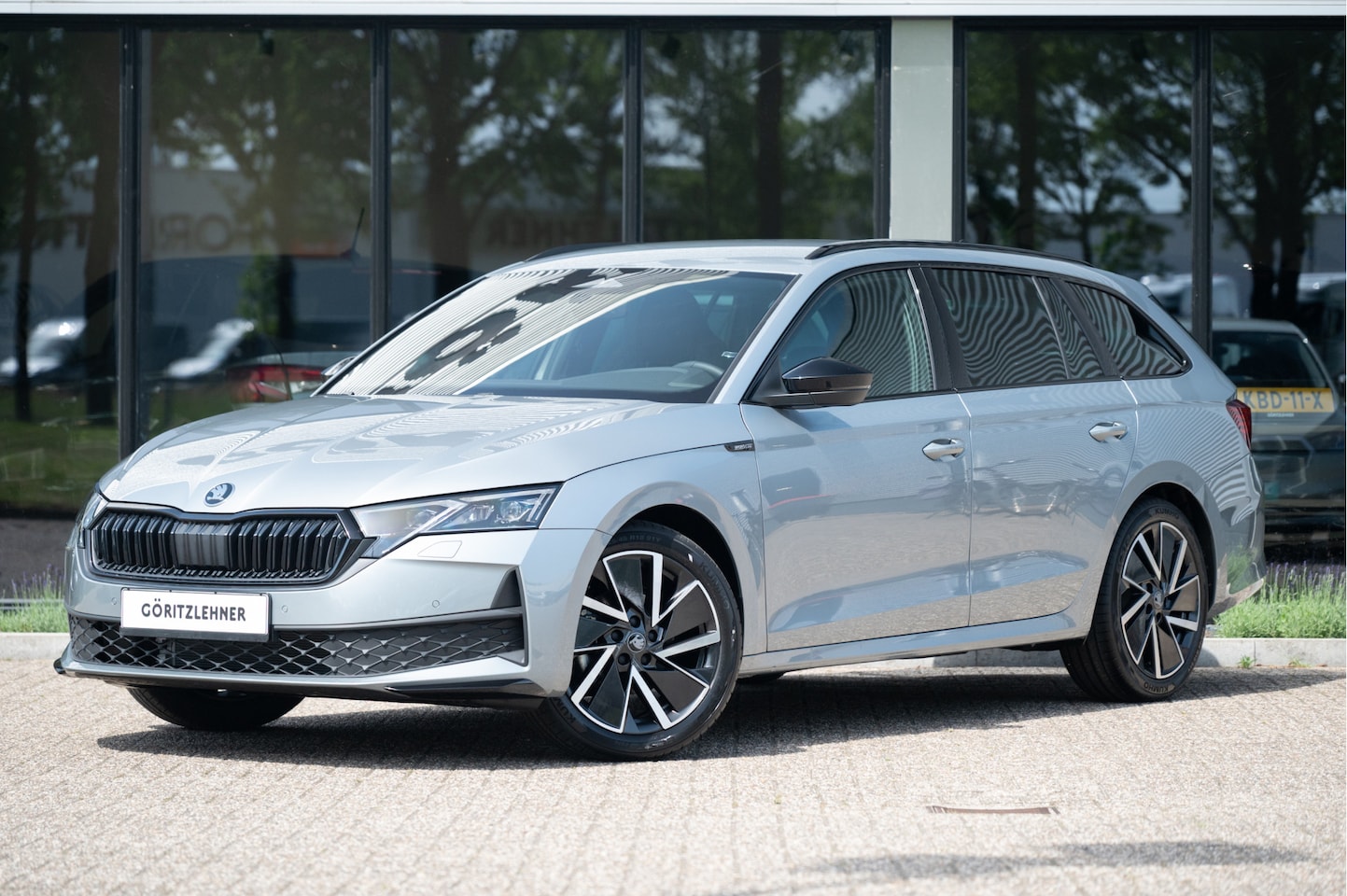 Skoda Octavia Combi - 1.5 TSI MHEV Sportline Business | Trekhaak | Matrix LED | Navi | Stoel- Stuurverw. | Side - AutoWereld.nl