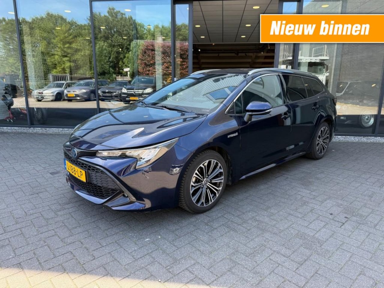 Toyota Corolla Touring Sports - 1.8 Hybrid Business Touring Sports 1.8 Hybrid Business+,Half Leer,LED,Stoelverw,Camera,Adapt Cruise,Navi,Carpl - AutoWereld.nl