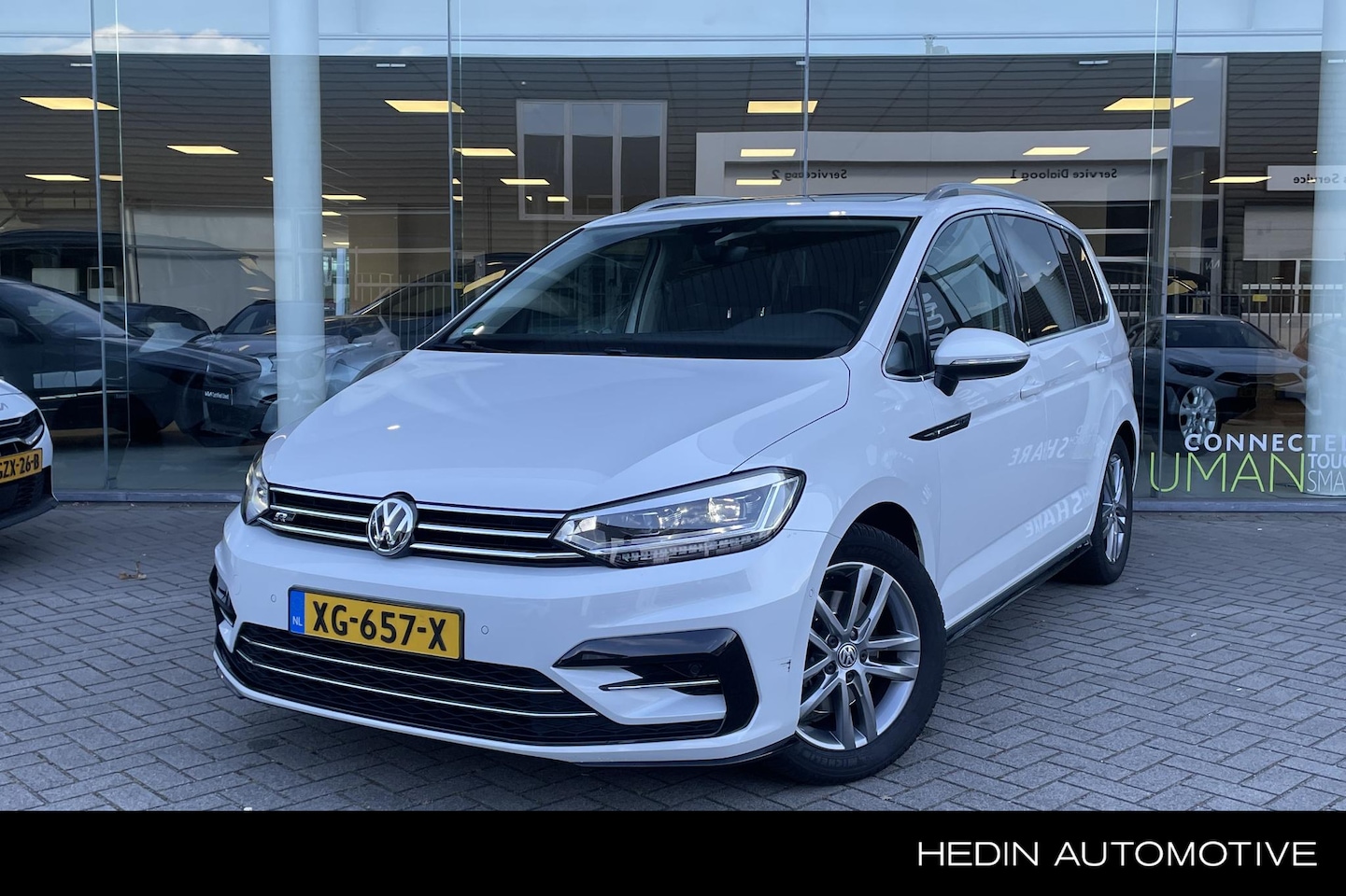 Volkswagen Touran - 1.5 TSI Highline 7p | Panoramadak | Nav | Trekhaak | Camera | - AutoWereld.nl