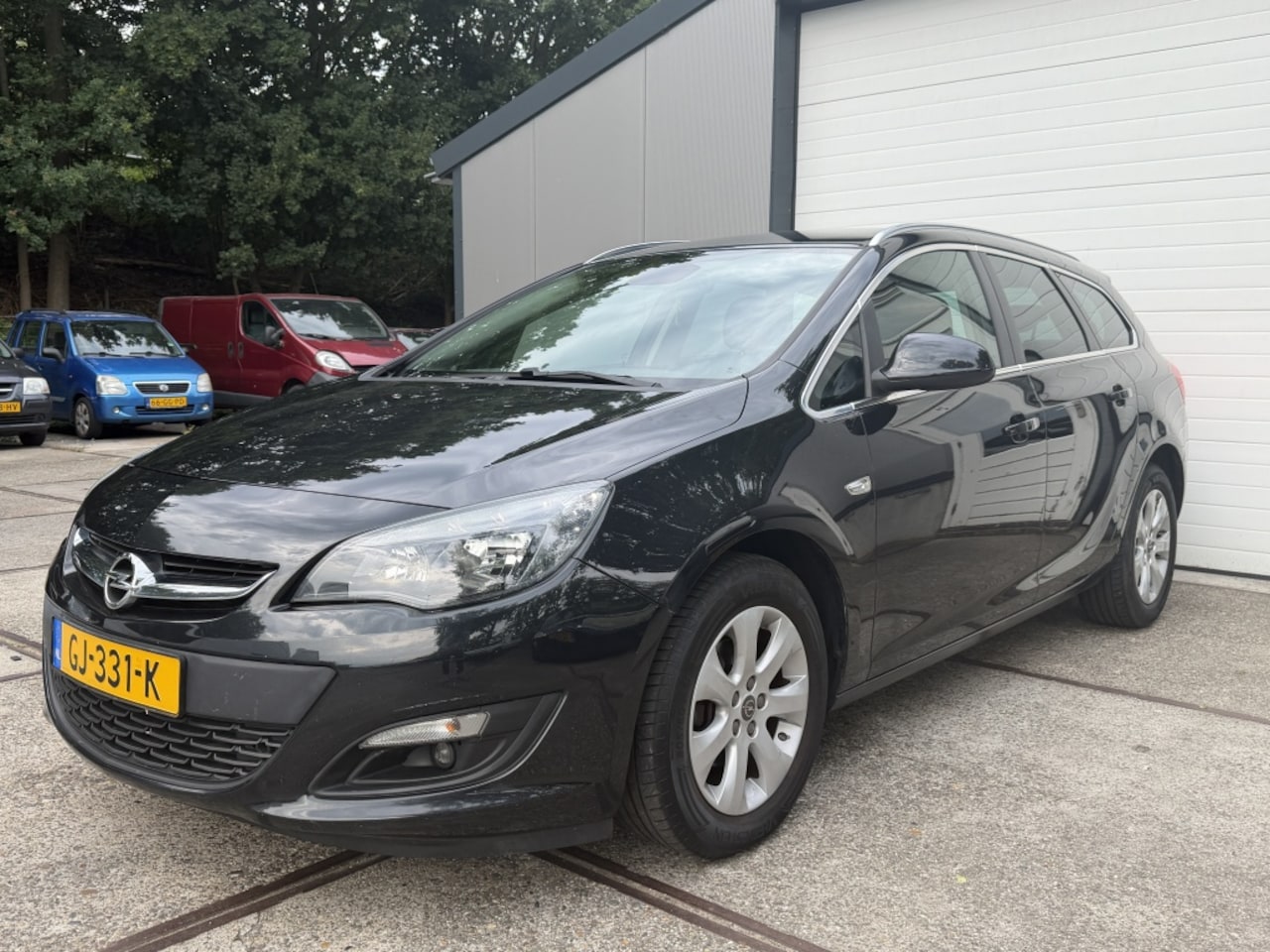 Opel Astra Sports Tourer - 1.4 Turbo Blitz | Airco | Navi | Pdc | Apk - AutoWereld.nl