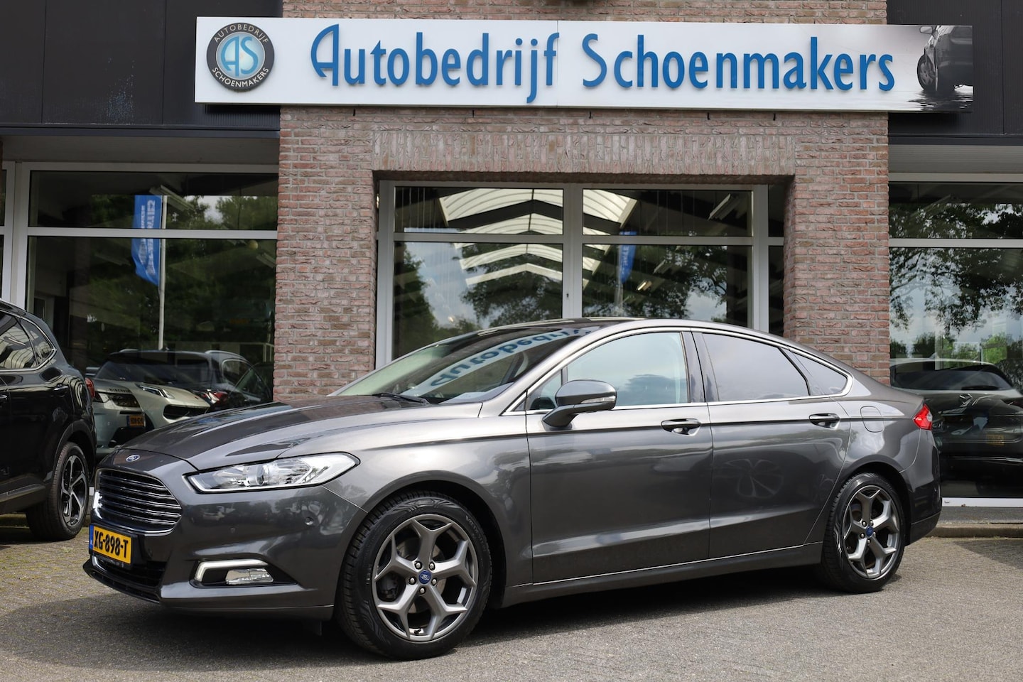 Ford Mondeo - 2.0 IVCT HEV Titanium RUITVERWARMING ALL-SEASONS NAVI DAB 18"LMV SFEERVERLICHTING 2xPDC NA - AutoWereld.nl