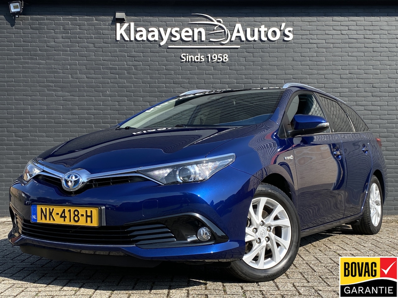 Toyota Auris Touring Sports - 1.8 Hybrid 136 pk Trend AUT. | navigatie | panoramadak | climate control | camera | privac - AutoWereld.nl