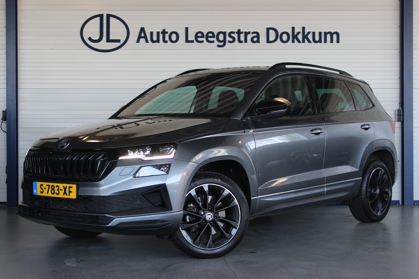 Skoda Karoq - 1.5 TSI ACT Sportline Business Trekhaak | Camera | Keyless | Adapt. Cruise | Stoel/Stuurve - AutoWereld.nl