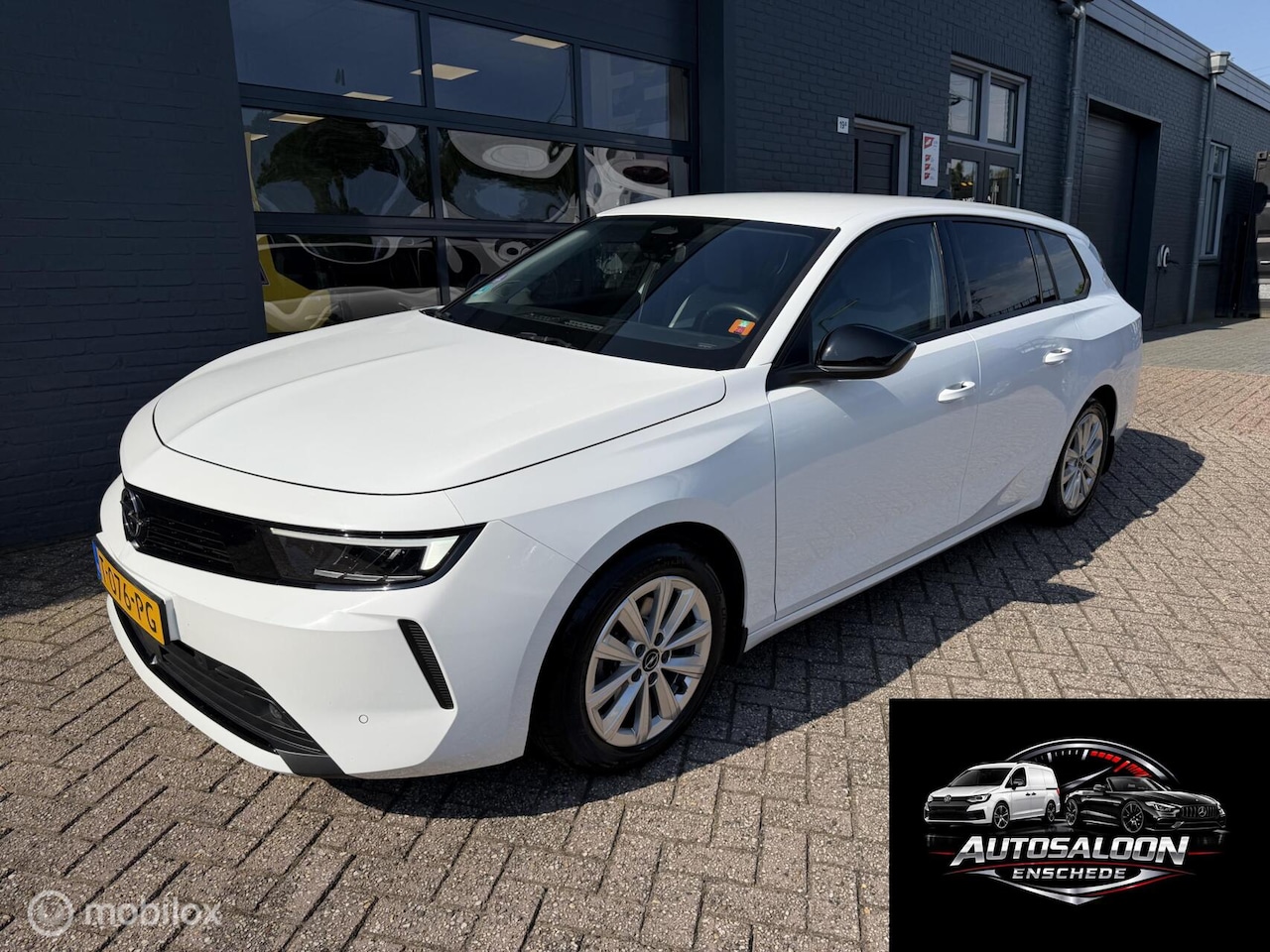 Opel Astra Sports Tourer - 1.2 110 PK Airco Navi Camera PDC - AutoWereld.nl