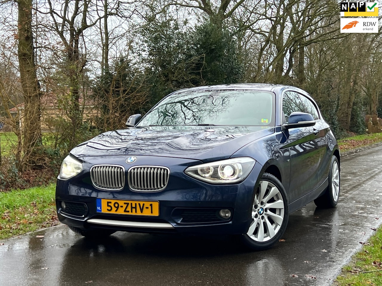 BMW 1-serie - 116i Upgrade Edition | Leder + Navi + Cruise + Airco Nu € 6.999,-!!! - AutoWereld.nl