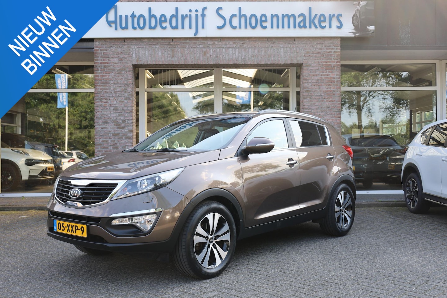 Kia Sportage - 2.0 X-clusive NAP TREKHAAK CAMERA 4XSTOELVERW. LEER CRUISE CLIMA NAVI 2XPDC 18''LMV - AutoWereld.nl