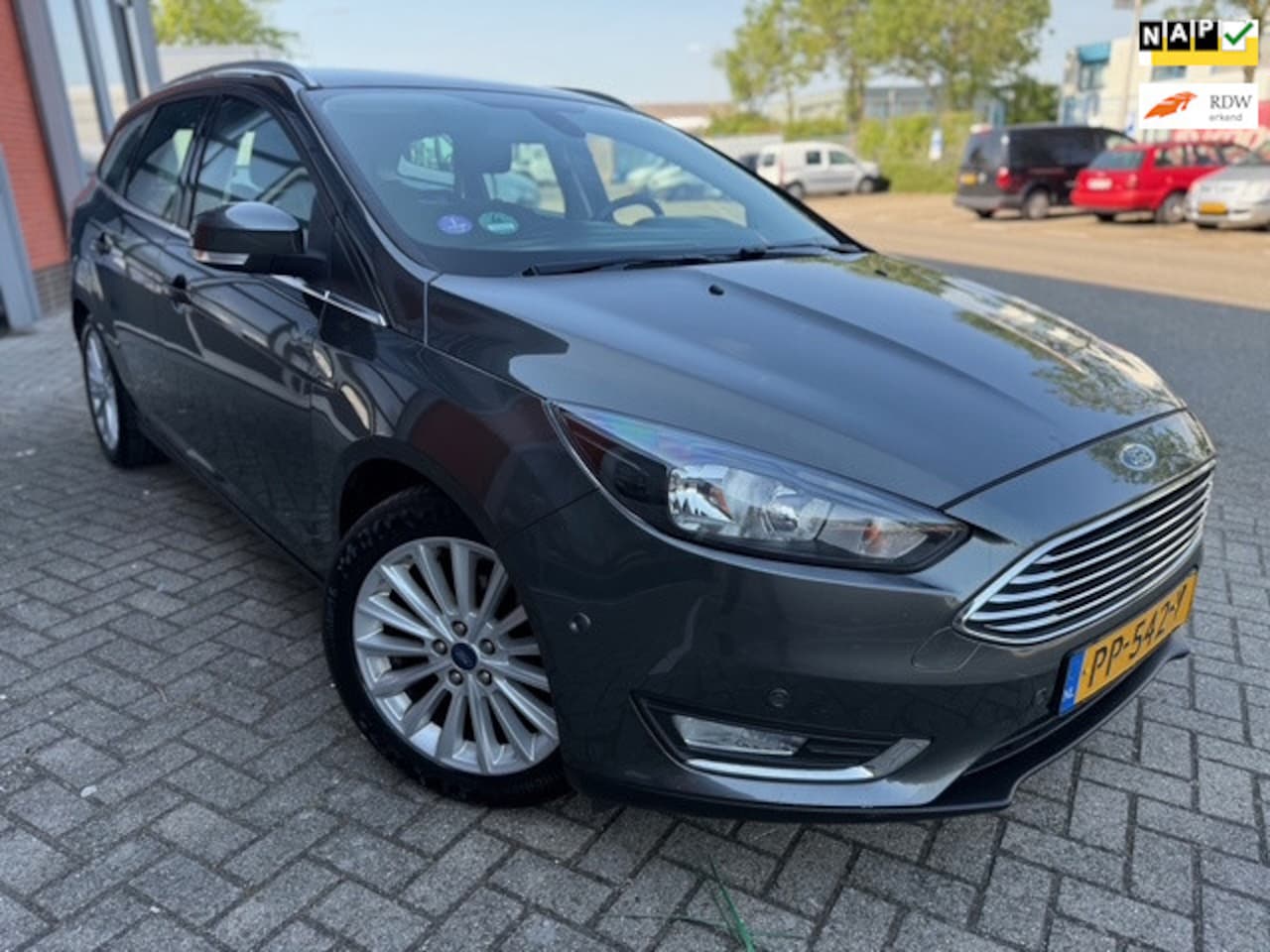 Ford Focus Wagon - 1.0 Titanium Edition | Keyless | NAP | Navi | Bluetooth - AutoWereld.nl