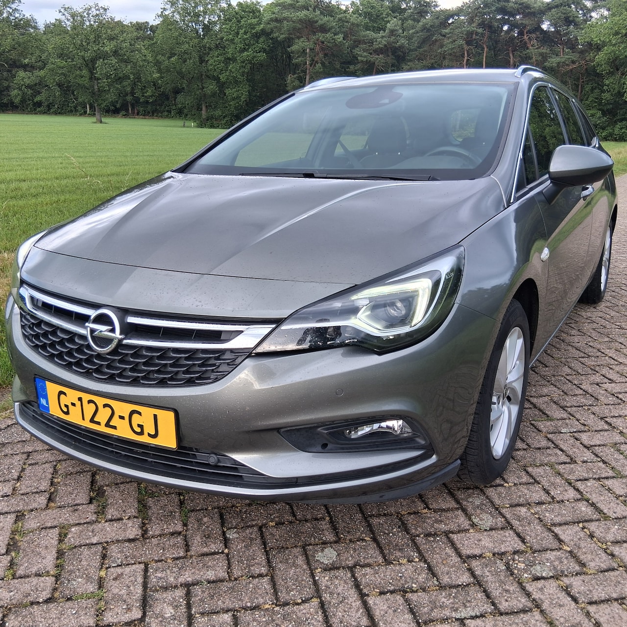 Opel Astra Sports Tourer - 1.0 Innovation Luxe oirginele Nederlandse opel astra sportstourder - AutoWereld.nl