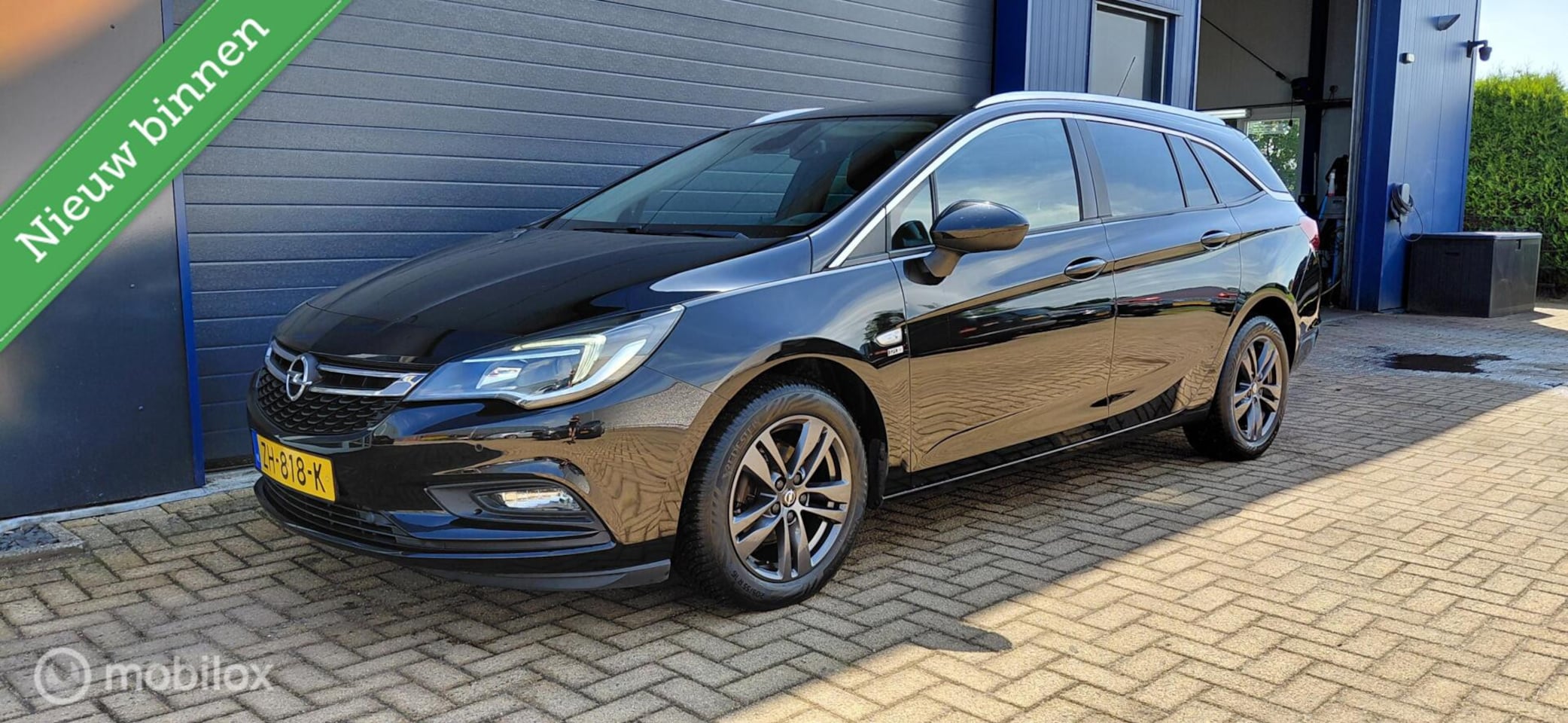 Opel Astra Sports Tourer - 1.4 Turbo 120 Jaar Edition 1.4 Turbo 120 Jaar Edition - AutoWereld.nl