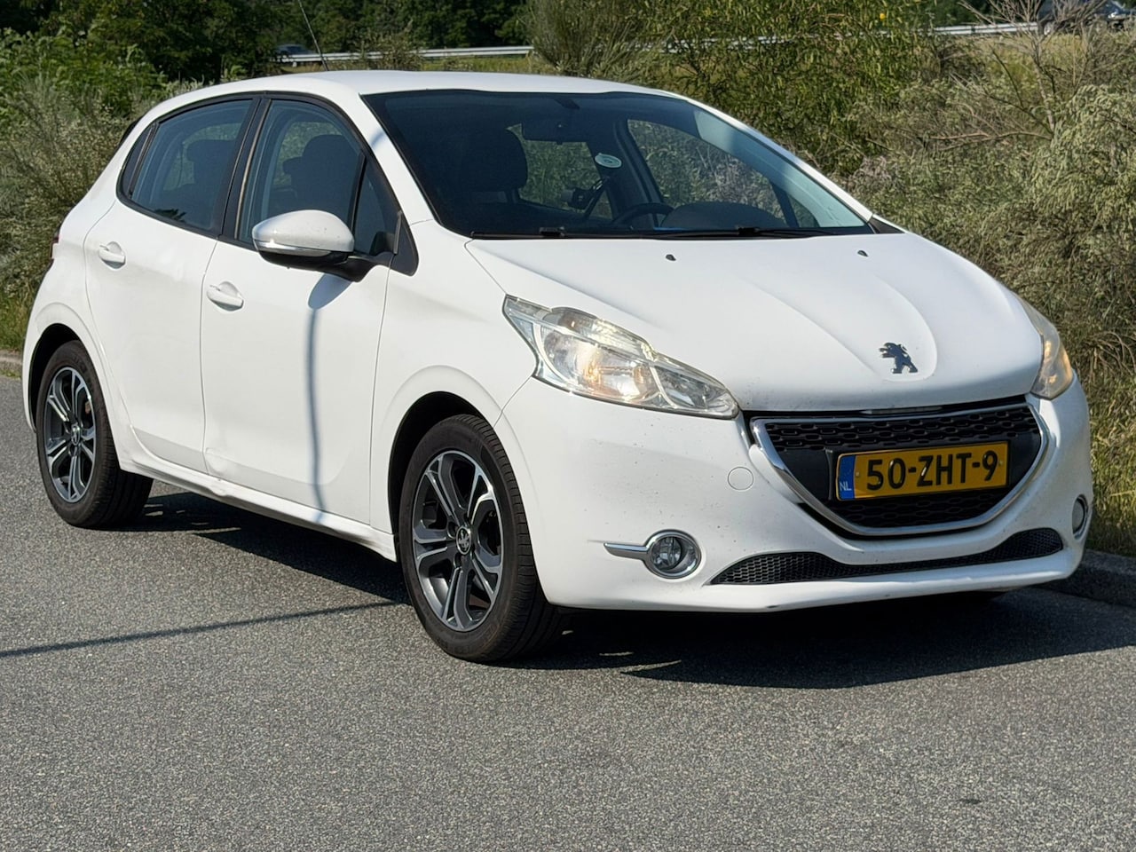 Peugeot 208 - 1.2 VTi Access navi bt elect ramen airco cruise - AutoWereld.nl