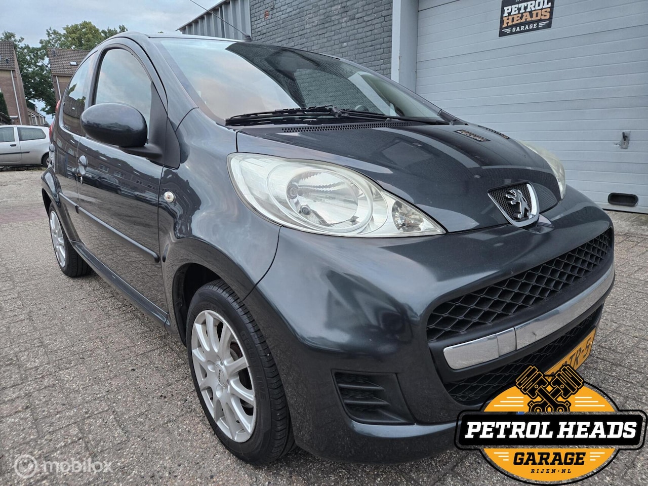 Peugeot 107 - 1.0-12V Sportium 5D | NAP | Airco | LM velg - AutoWereld.nl