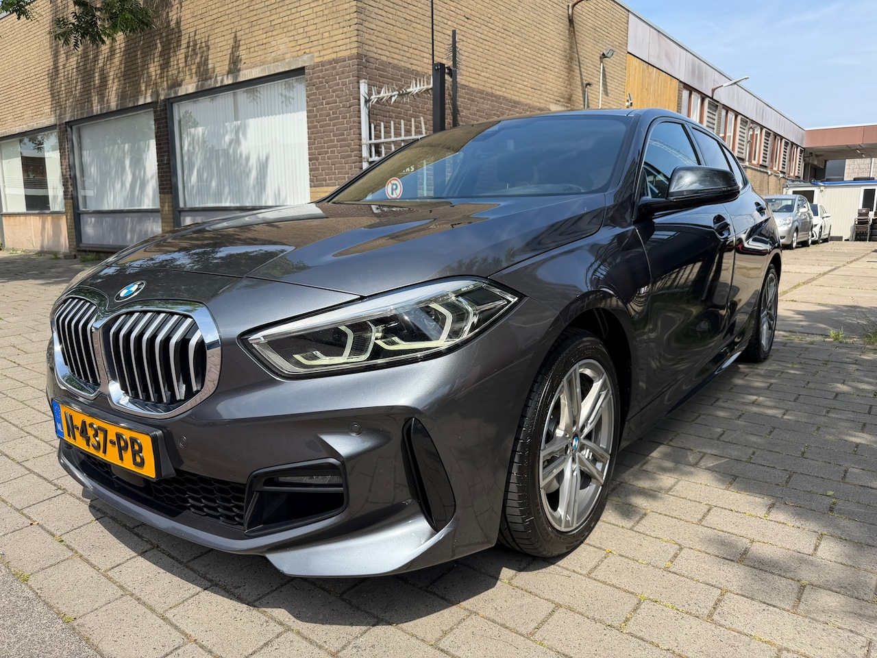 BMW 1-serie - 118i High Executive M pakket/carplay - AutoWereld.nl