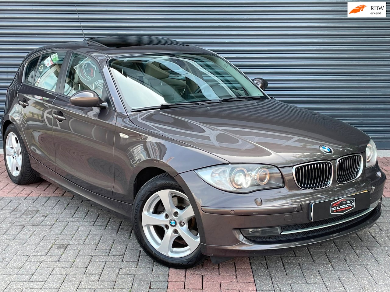 BMW 1-serie - 120i Automaat | Schuifdak | Memory | Leder | Navi | Cruise | Clima - AutoWereld.nl