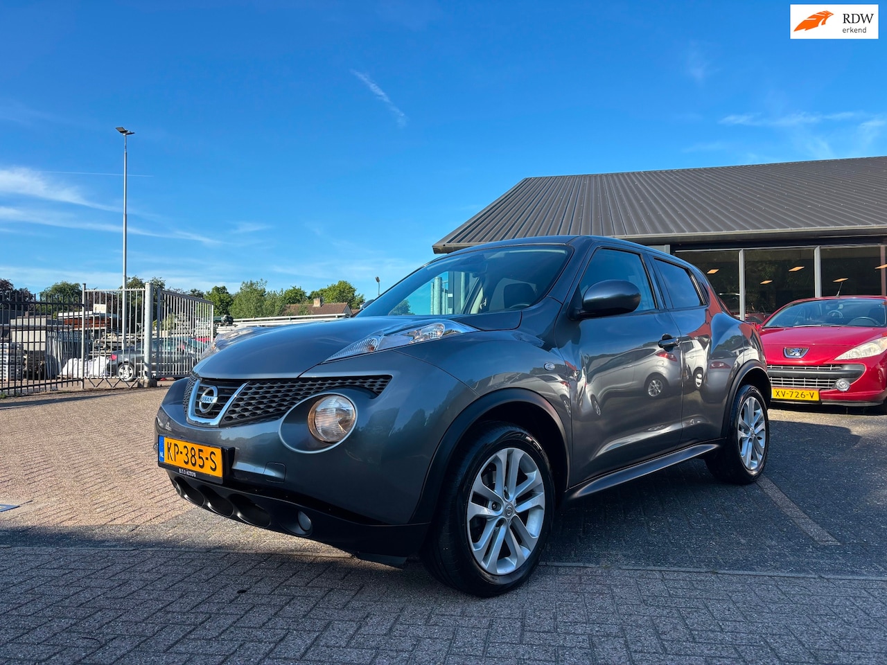 Nissan Juke - 1.6 Tekna / Airco / Cruise control / L.m velgen / Keyless entry - AutoWereld.nl
