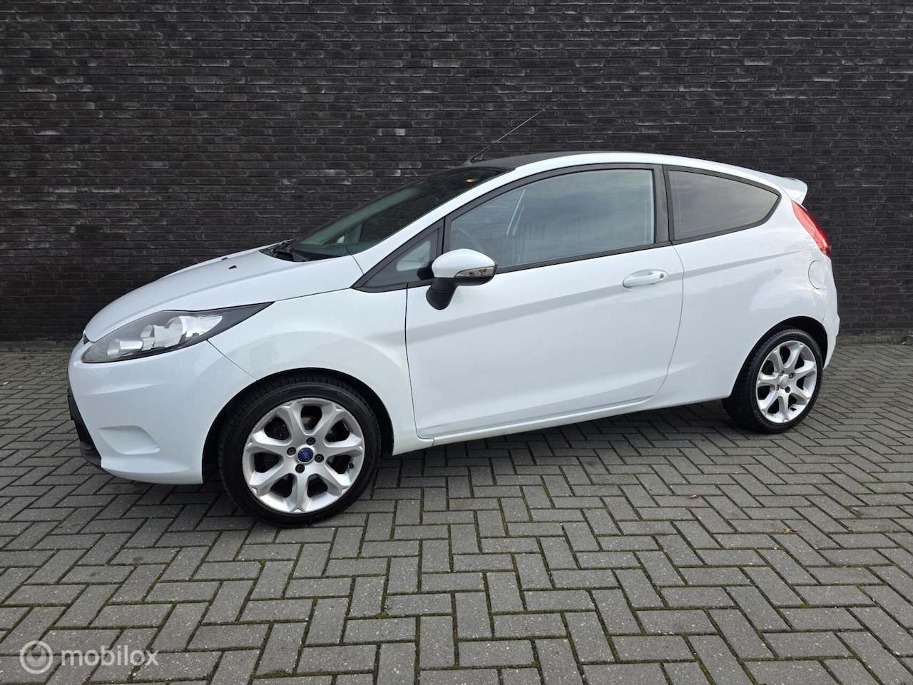Ford Fiesta - 1.25 Titanium|Sportief|Airco|Aux|Netjes| - AutoWereld.nl