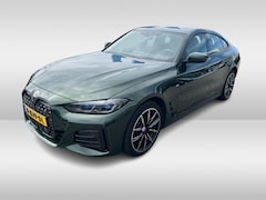BMW i4 - eDrive40 High Executive 84 kWh / SoH 99% / Trekhaak / Schuifdak / Camera / Head-up / Leder