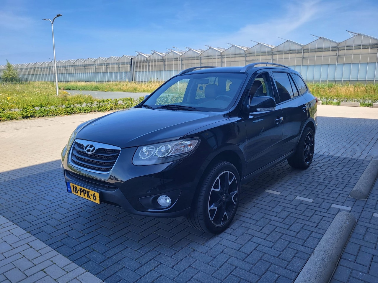 Hyundai Santa Fe - 2.4i CVVT 4WD Dynamic AUTOMAAT LEER CLIMA ZWART 2011 - AutoWereld.nl