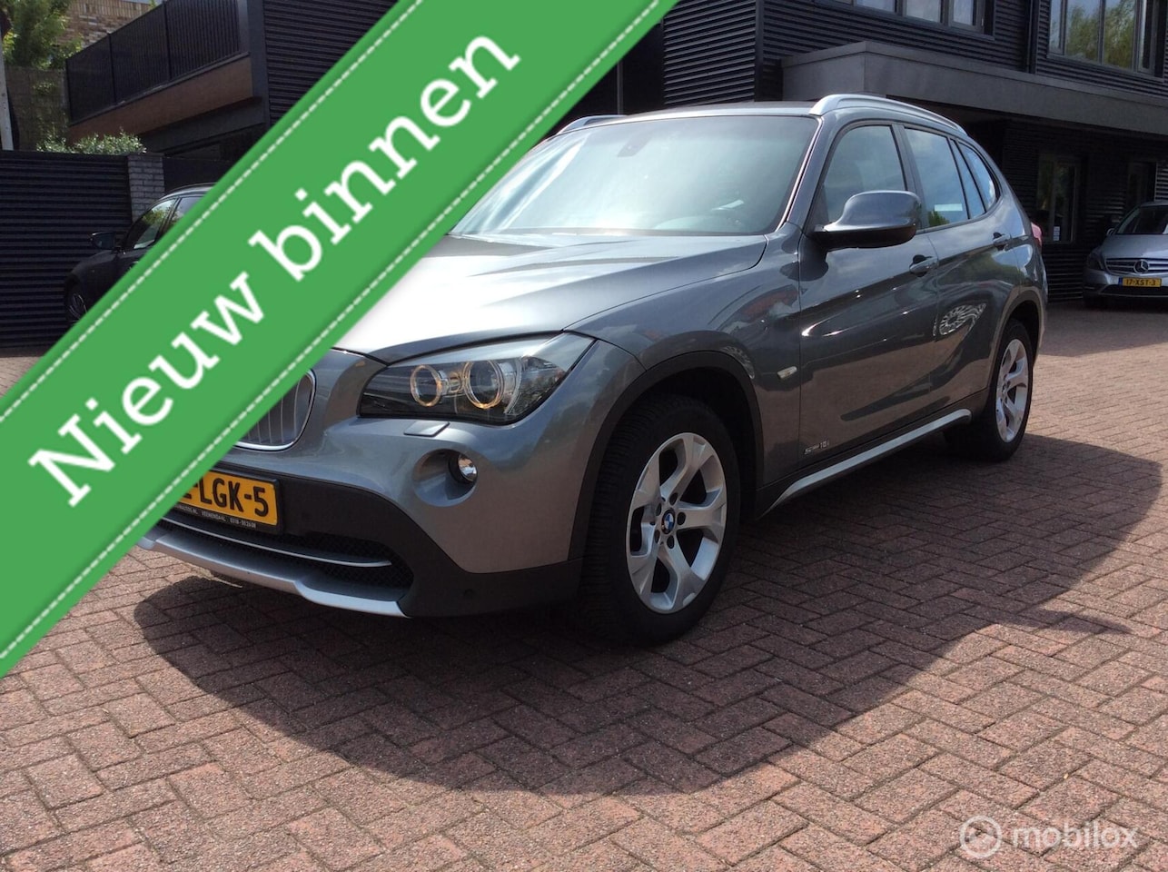 BMW X1 - sDrive18i Automaat Sportinter Airco 17"LM vlg Nap Dakr - AutoWereld.nl