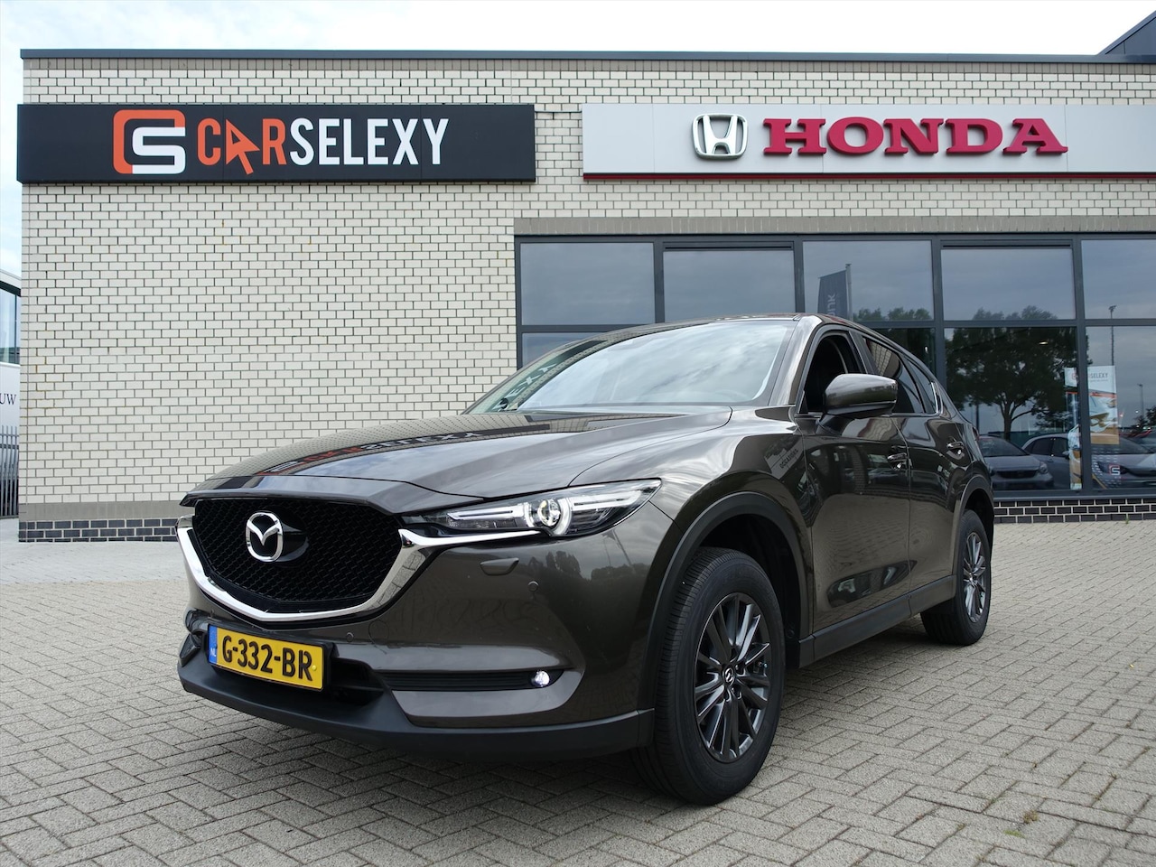 Mazda CX-5 - 2.0 SKYACTIV-G 165pk 2WD Aut Business Comfort Afneembare Trekhaak 2000 kg trekken - AutoWereld.nl