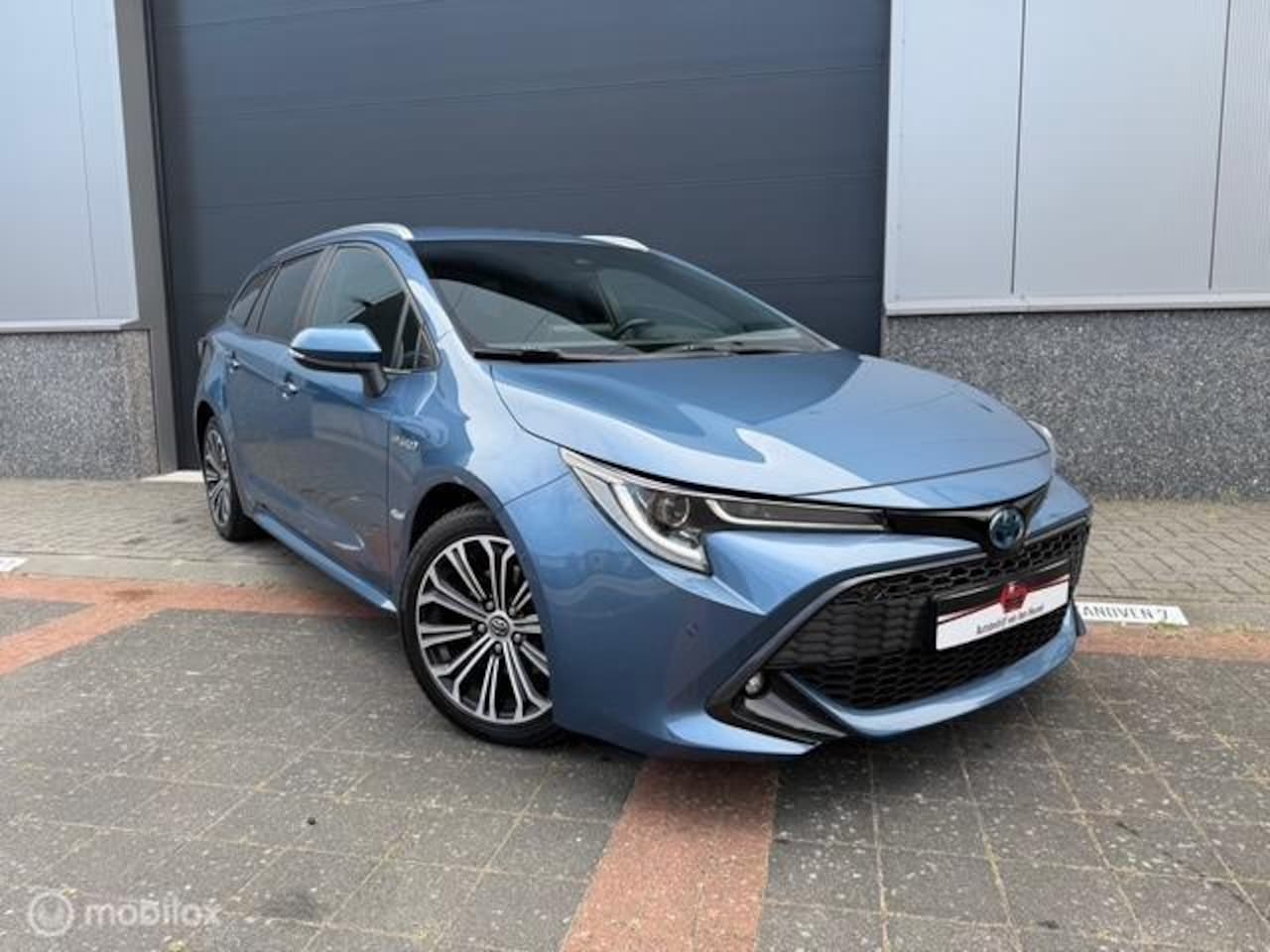 Toyota Corolla Touring Sports - 2.0 Hybrid Executive Navi - AutoWereld.nl