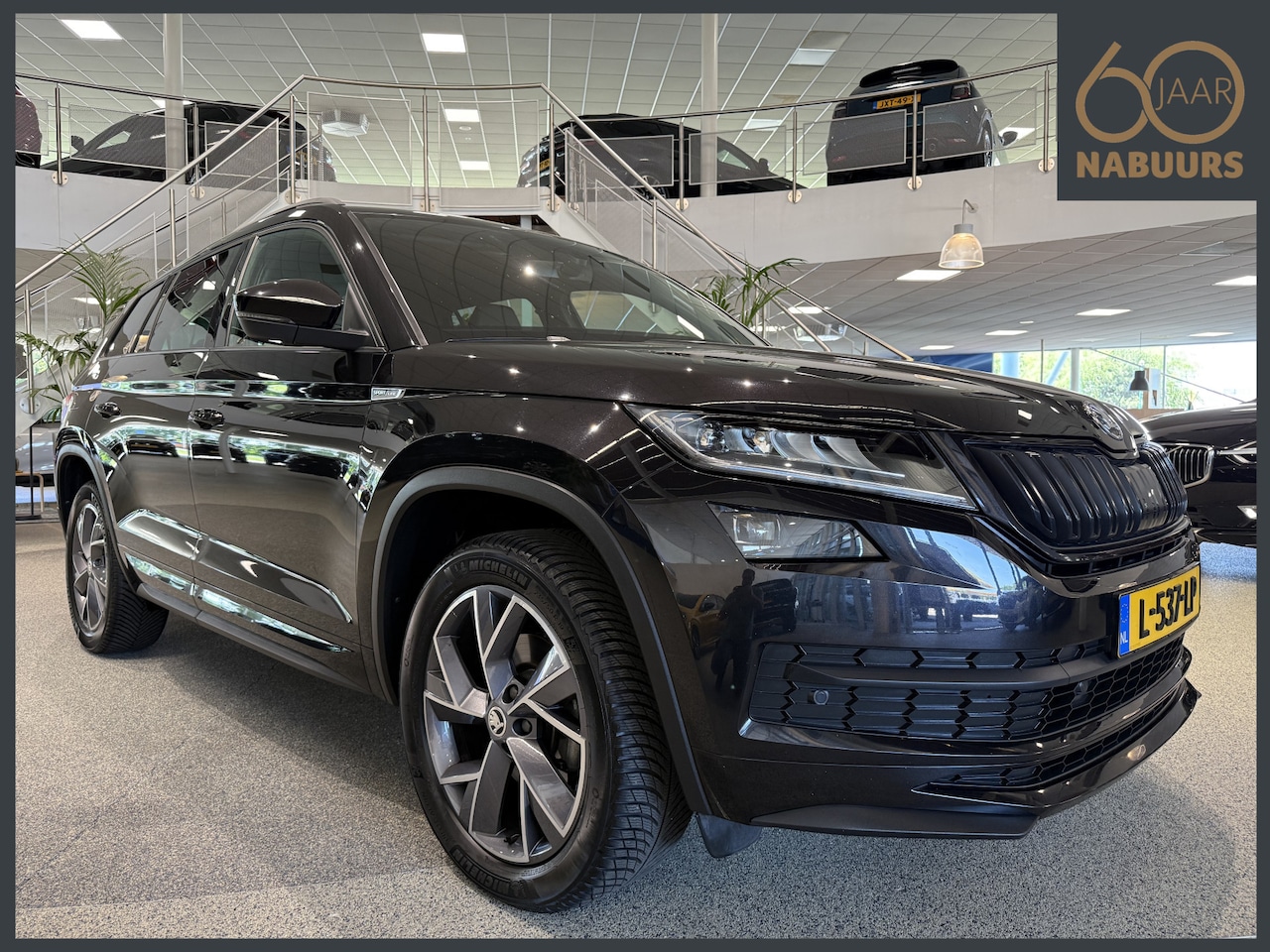 Skoda Kodiaq - 1.5 TSI Sportline Business 5p, NL auto, Trekhaak, Camera - AutoWereld.nl