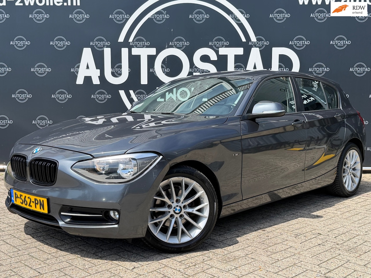 BMW 1-serie - 116d High Executive Automaat / Navi / Airco / APK / Trekhaak - AutoWereld.nl