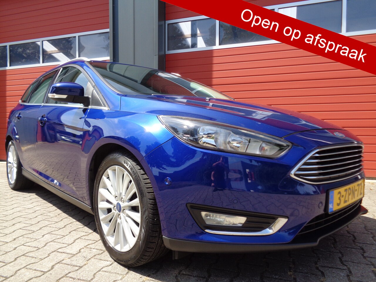 Ford Focus Wagon - 1.0 First Edition 126PK Clima Cruise LMV Navi Trekhaak NL-Auto - AutoWereld.nl