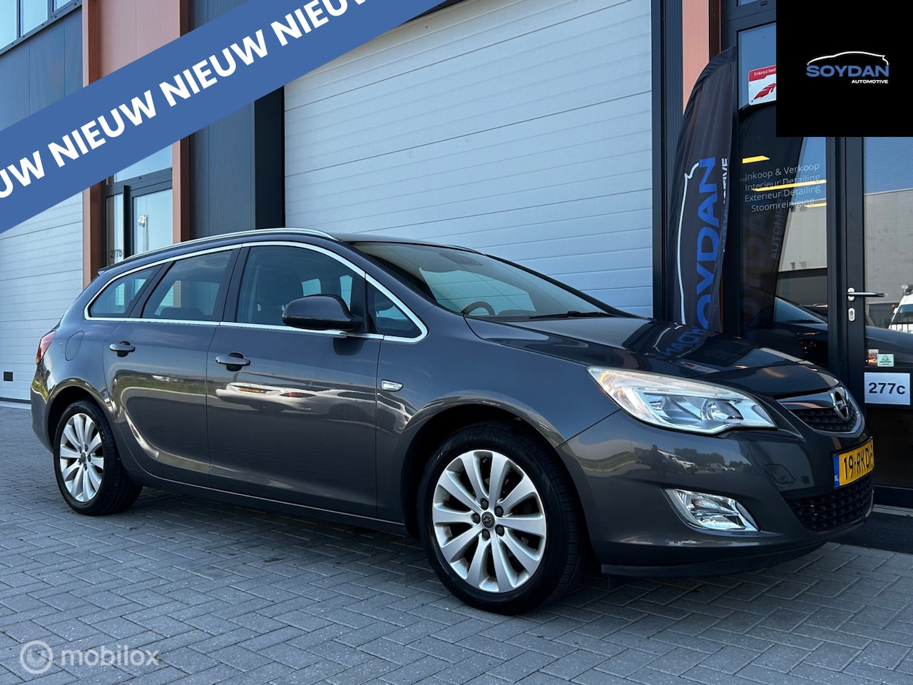 Opel Astra Sports Tourer - 1.4 Turbo Cosmo | AIRCO | CRUISE | TREKHAAK - AutoWereld.nl