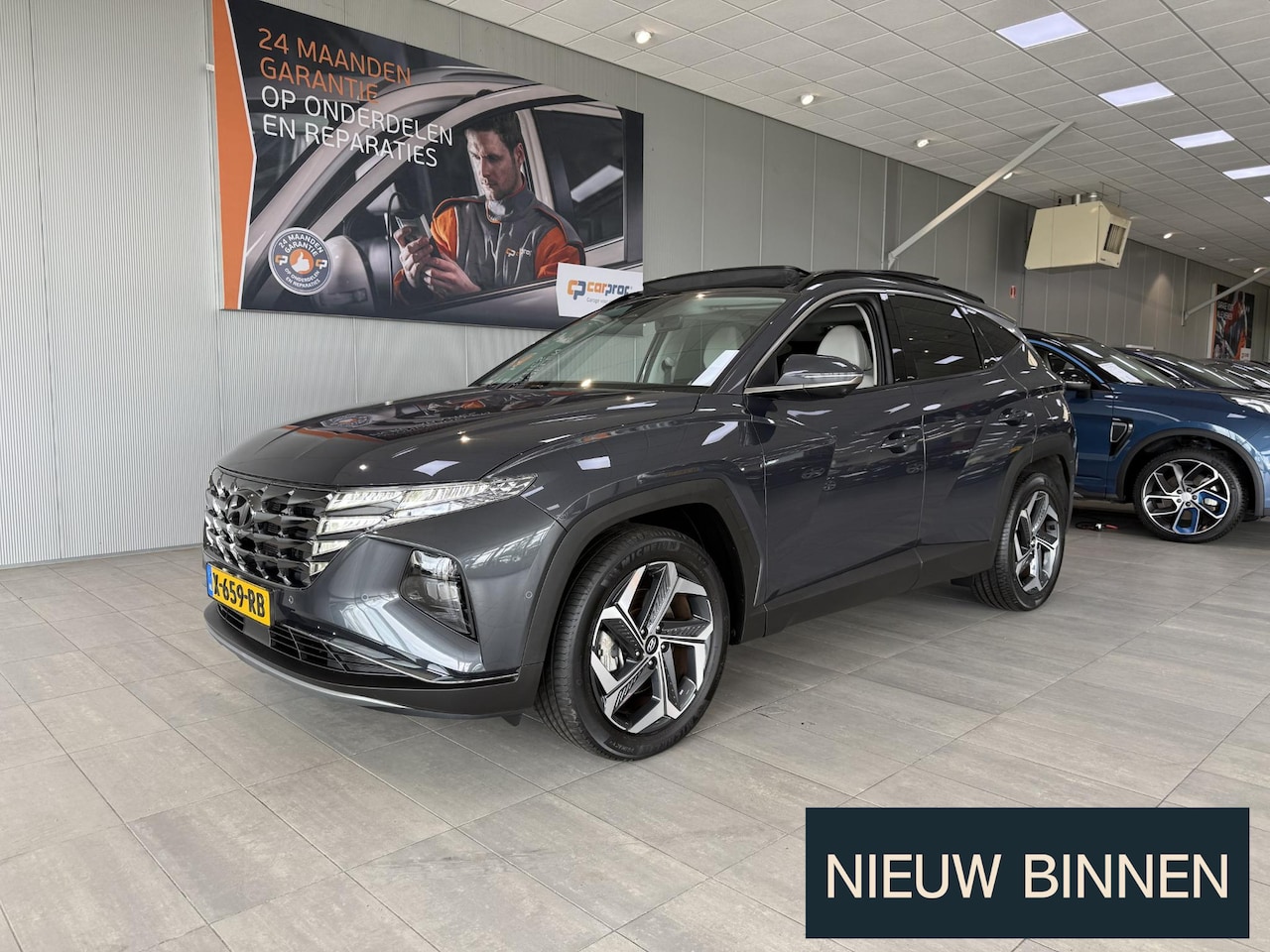 Hyundai Tucson - 1.6 T-GDI HEV Premium Sky 1.6 T-GDI HEV Premium Sky - AutoWereld.nl