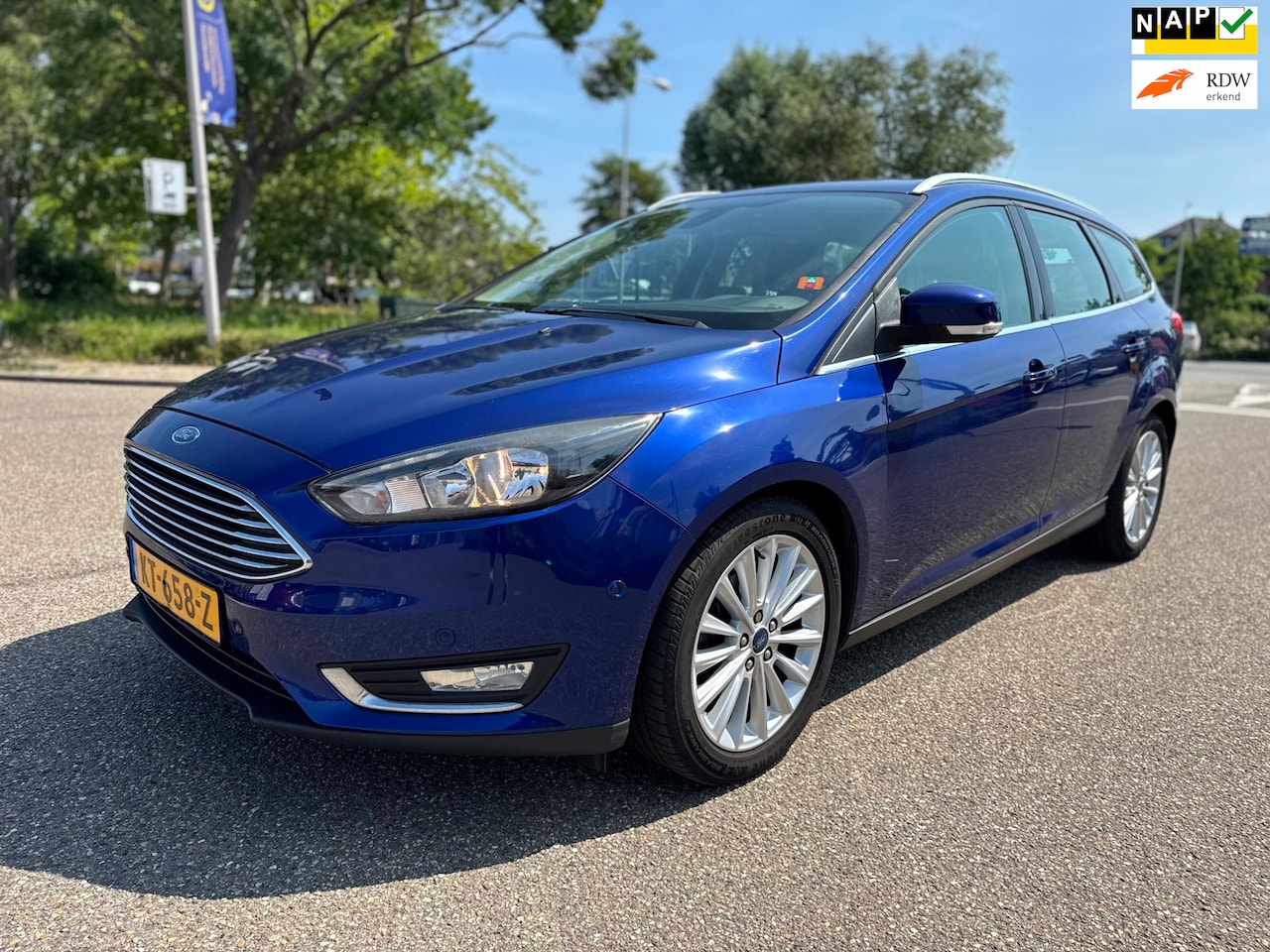Ford Focus Wagon - 1.0 Titanium / 1e.eigenaar / airco / cruise.control / elek.pakket / navi / pdc / lmv / nap - AutoWereld.nl